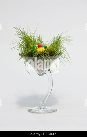 Happy Easter colorful jellybeans candies in a glass isolated cup out cutout pictures images very high resolution vertical format in USA US hi-res Stock Photo