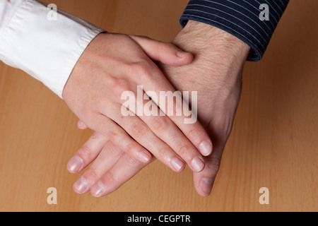 Hand in hand, young people Stock Photo