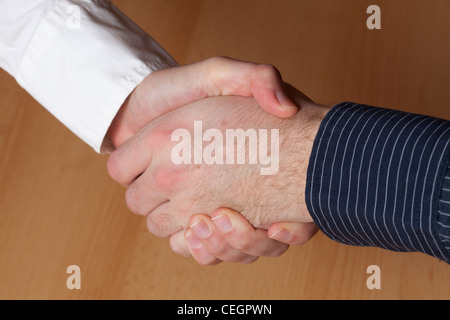 Hand in hand, young people Stock Photo