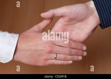 Shake hands, young people Stock Photo