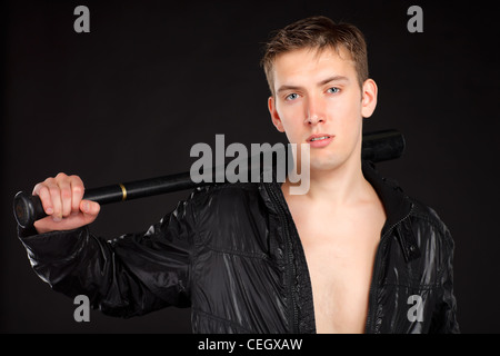 Young man with baseball-bat. Stock Photo