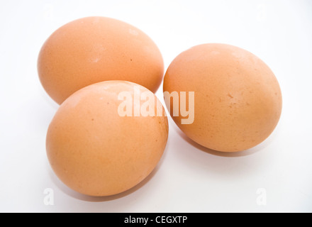 Three eggs on the white background. Stock Photo