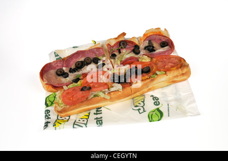 Subway spicy italian deli meat footlong submarine sandwich with lettuce, tomato black olives on wrapper on white background cutout USA. Stock Photo