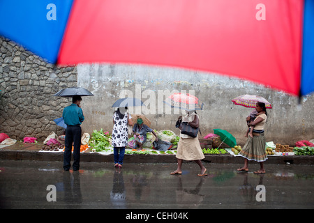 People on a rainy day at road side market Kandy Sri Lanka Asia Stock Photo