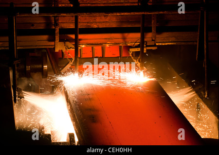 Gas cutting of the hot metal inside of plant Stock Photo