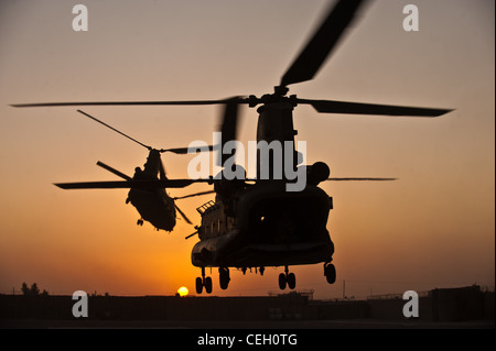 Two Royal air force CH-47 Chinooks take off from Task Force Helmand headquarters in Lashkar Gah district, Helmand province, Sept. 22. Stock Photo