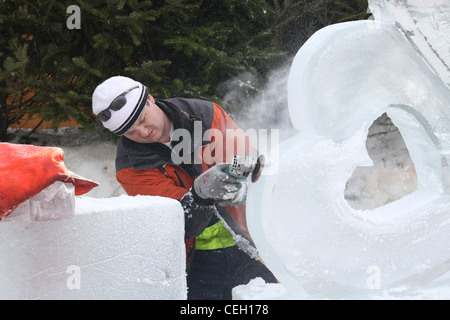 Ice sculpture using a power hand sander Stock Photo