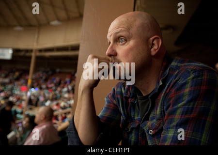 man in a crowd staring intently Stock Photo