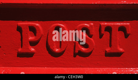 The word Post on a red letter box Stock Photo