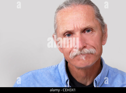 Middle aged man looking worried, concerned angry.  On white background. Stock Photo