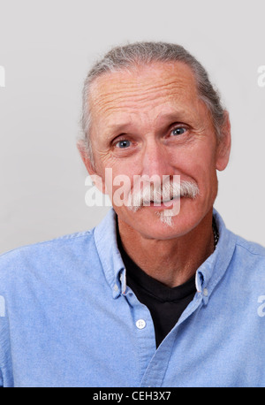 Middle aged man looking worried, concerned angry.  On white background. Stock Photo
