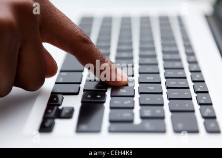 Female finger typing on computer keyboard Stock Photo