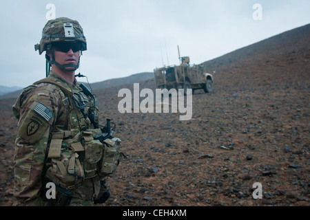 U.S. Army 1st Lt. Dave Groseclose, from Clemens, N.C., 3rd Platoon leader for A Battery, 2nd Battalion, 377th Parachute Field Artillery Regiment, Task Force Spartan, surveys the route up to Observation Post 11 outside Forward Operating Base Salerno, Feb. 3. Third Platoon executed a call for fire exercise from the top of OP 11, an important procedure that calibrates large weapons, in this case the M-777 155mm howitzers on FOB Salerno. Stock Photo