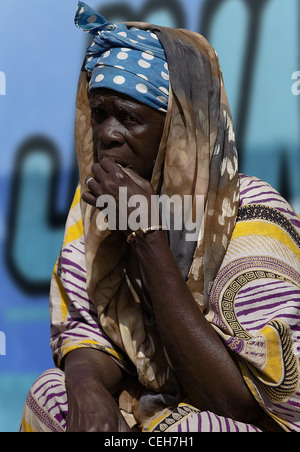 Gambian man/woman in a street market in Gambia,the photo is in colour. Stock Photo