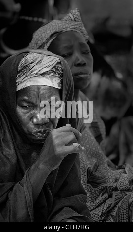 Gambian man/woman in a street market in Gambia,the photo is in colour. Stock Photo