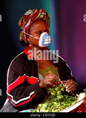 Gambian man/woman in a street market in Gambia,the photo is in colour. Stock Photo