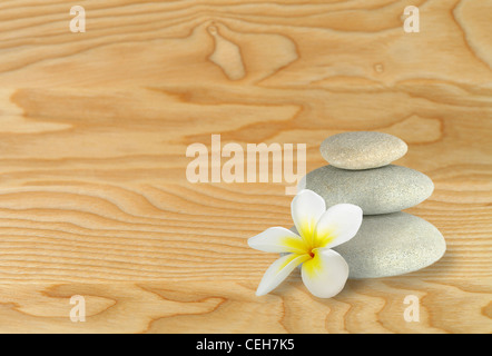 Pebble stones on wooden  surface Stock Photo