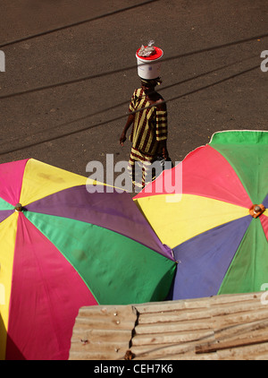 Gambian man/woman in a street market in Gambia,the photo is in colour. Stock Photo