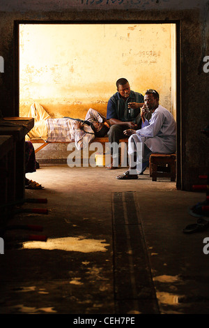 Gambian man/woman in a street market in Gambia,the photo is in colour. Stock Photo