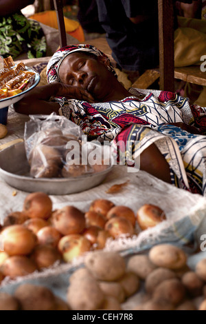 Gambian man/woman in a street market in Gambia,the photo is in colour. Stock Photo