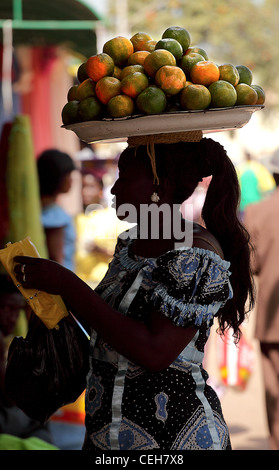 Gambian man/woman in a street market in Gambia,the photo is in colour. Stock Photo