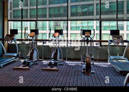 gym with large windows and a stationary bike Stock Photo