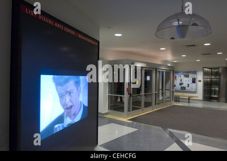 For MIT's 2008 Campus Preview Weekend, hackers modified the List Visual Arts Center Media Test Wall so that it played Rick Astley's 1987 music video Never Gonna Give You Up after every four repeats of the usual art-house film. Stock Photo