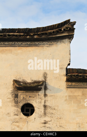 A Chinese Hui Style house with black roof tiles, white wall, and decorated with artworks Stock Photo