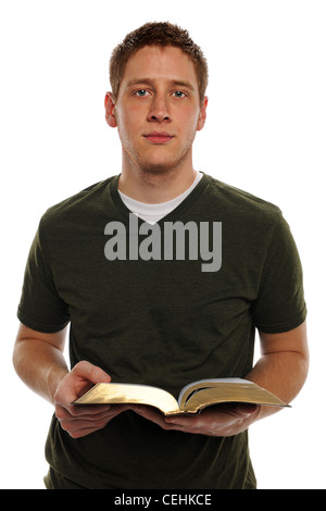 Young Man casually dressed holding open bible Stock Photo