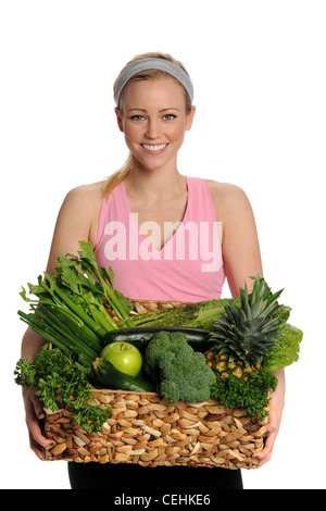 Blonde customer holding a vegetables basket Stock Photo - Alamy