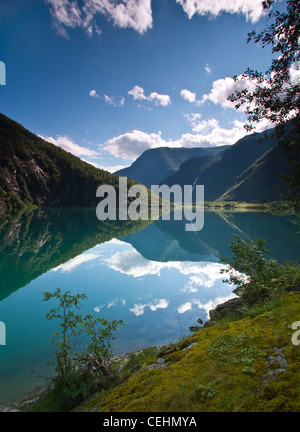 Clouds reflected in Norwegian glacial water. Stock Photo