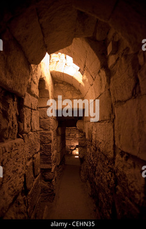 Narrow passage at the underground Western Wall tunnels which are a man-made set of tunnels dug to research the Western Wall and antiquities related to it, Most of the tunnel is in continuation of the open-air Western Wall and is located under buildings of the Muslim Quarter of the Old City of Jerusalem. Israel Stock Photo