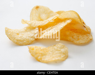 A bunch of potato chips on white Stock Photo