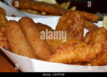 fish and chips, calamari, Chiko Roll, potato scallop, lemon fried seafood Stock Photo