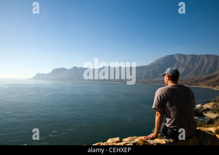 Tourist looking out to sea,Gordon's Bay,Western Cape Province Stock Photo