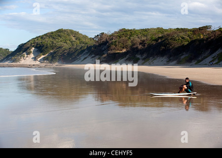 Surfer on the beach,Cintsa,Eastern Cape Stock Photo