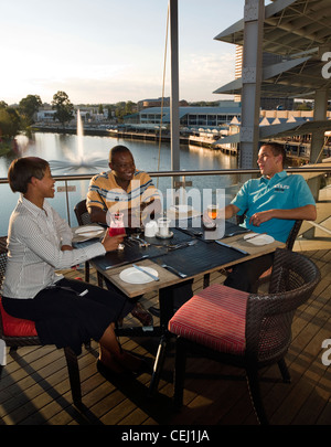 Tourists having sundowners at Cocos bar and restaurant at Loch Logan Waterfront in Bloemfontein,Free State Province Stock Photo