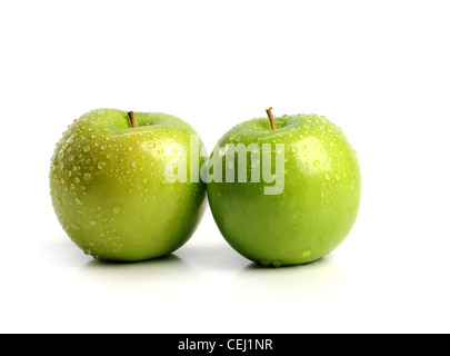 Two Green Apples with water drops isolated on a white background Stock Photo