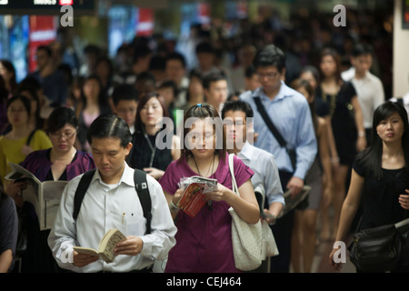 Commuters make their way to work through an underground passage in the ...