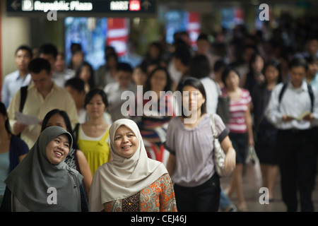 Commuters make their way to work through an underground passage in the ...