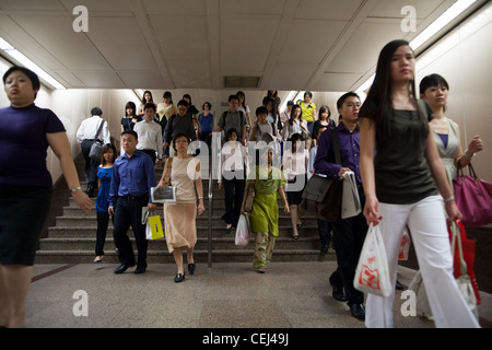 Commuters make their way to work through an underground passage in the ...