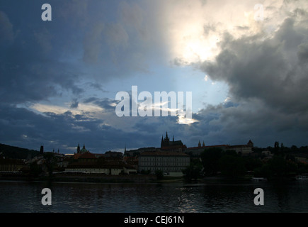 Prague Castle at dusk with the Vltava river in front. Stock Photo