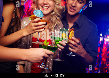 Young people spending time in nightclub celebrating an event Stock Photo