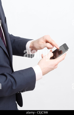 A business man typing on cell phone Stock Photo
