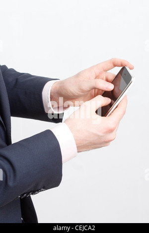 A business man typing on cell phone Stock Photo