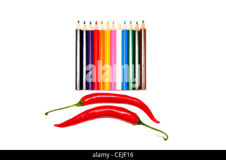 isolated on white colorful pencils palette and two peppers Stock Photo