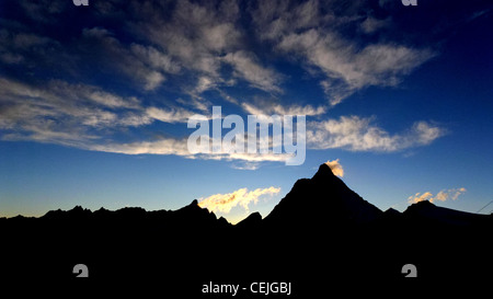 Sun setting behind the Matterhorn Stock Photo