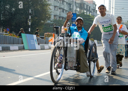 Handicapped Participant in 2008 Mumbai Marathon, waving at the Camera Stock Photo