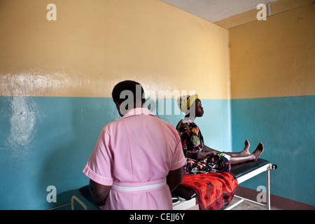 A woman receives a health exam at a clinic in Amuria, Uganda, East Africa. Stock Photo