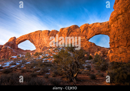 The North and South Window Arches form openings in the same sandstone fin. Arches Nat'l Park. Utah Stock Photo